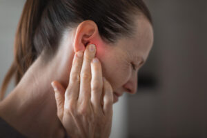 lady with painful ear wax build up